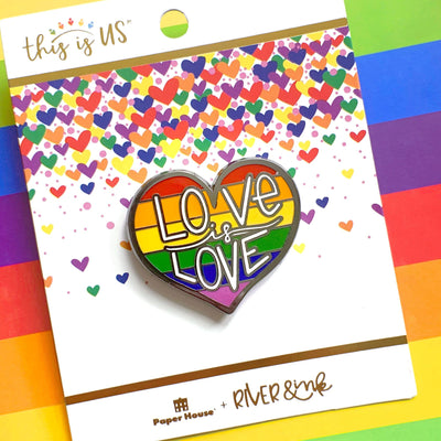 Love is Love enamel pin made of enamel and silver shown in package on rainbow colored background.