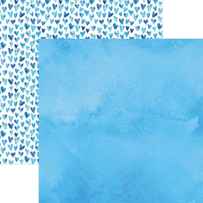 scrapbook paper image features a blue wash on front side and a blue heart pattern on back side.