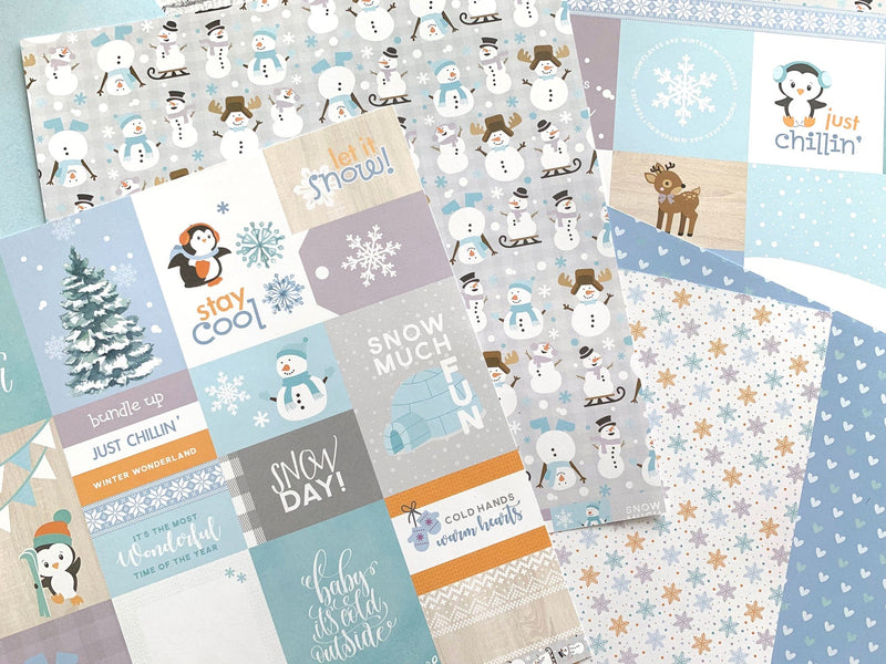 This craft kit image features winter themed tags and pattern papers of snowmen and penguins with blue, teal and white details.