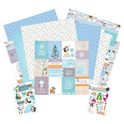 This craft kit image features winter themed tags and pattern papers shown with two sheets of winter themed stickers. Featuring text, snowmen and penguins with blue, teal and white details.