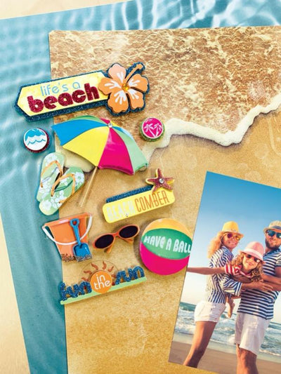 3D scrapbook sticker featuring beach theme is shown next to a photo of a family on the beach