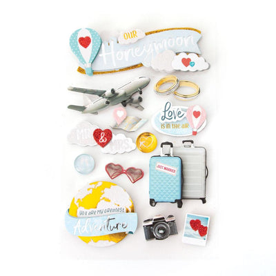 3D scrapbook stickers featuring honeymoon themed imagery including luggage, an airplane and hearts.