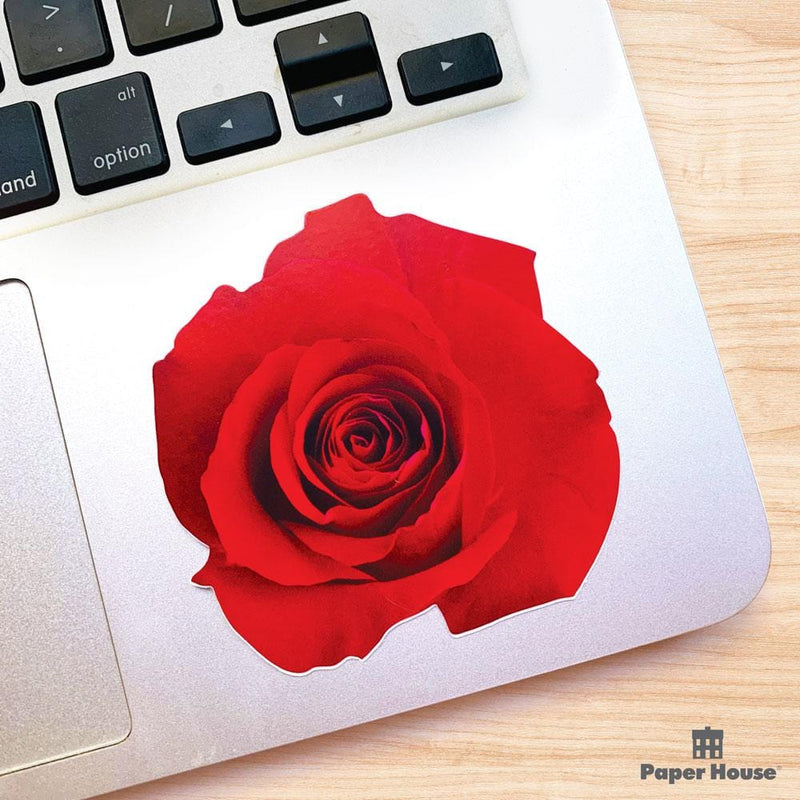 Shaped laptop sticker featuring a red photographic rose, shown on a computer laptop.