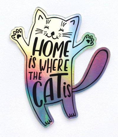 Shaped laptop sticker featuring a holographic illustrated cat with the words "Home is where the Cat is".