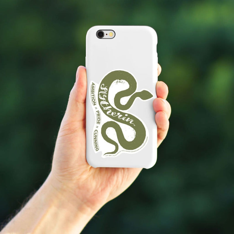 Shaped, vinyl sticker featuring a green snake with the words Slytherin, ambition, pride, and cunning shown on a cell phone held by a person against a green background.