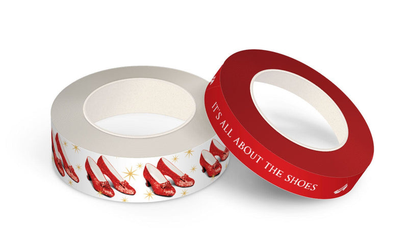 2 rolls of washi tape featuring ruby slippers and white text on red background, shown on white background.