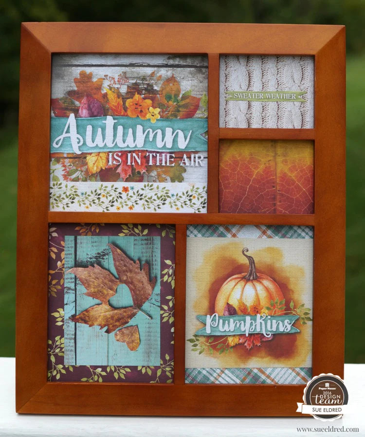 scrapbook frame featuring autumn leaves and pumpkins in a wooden frame.