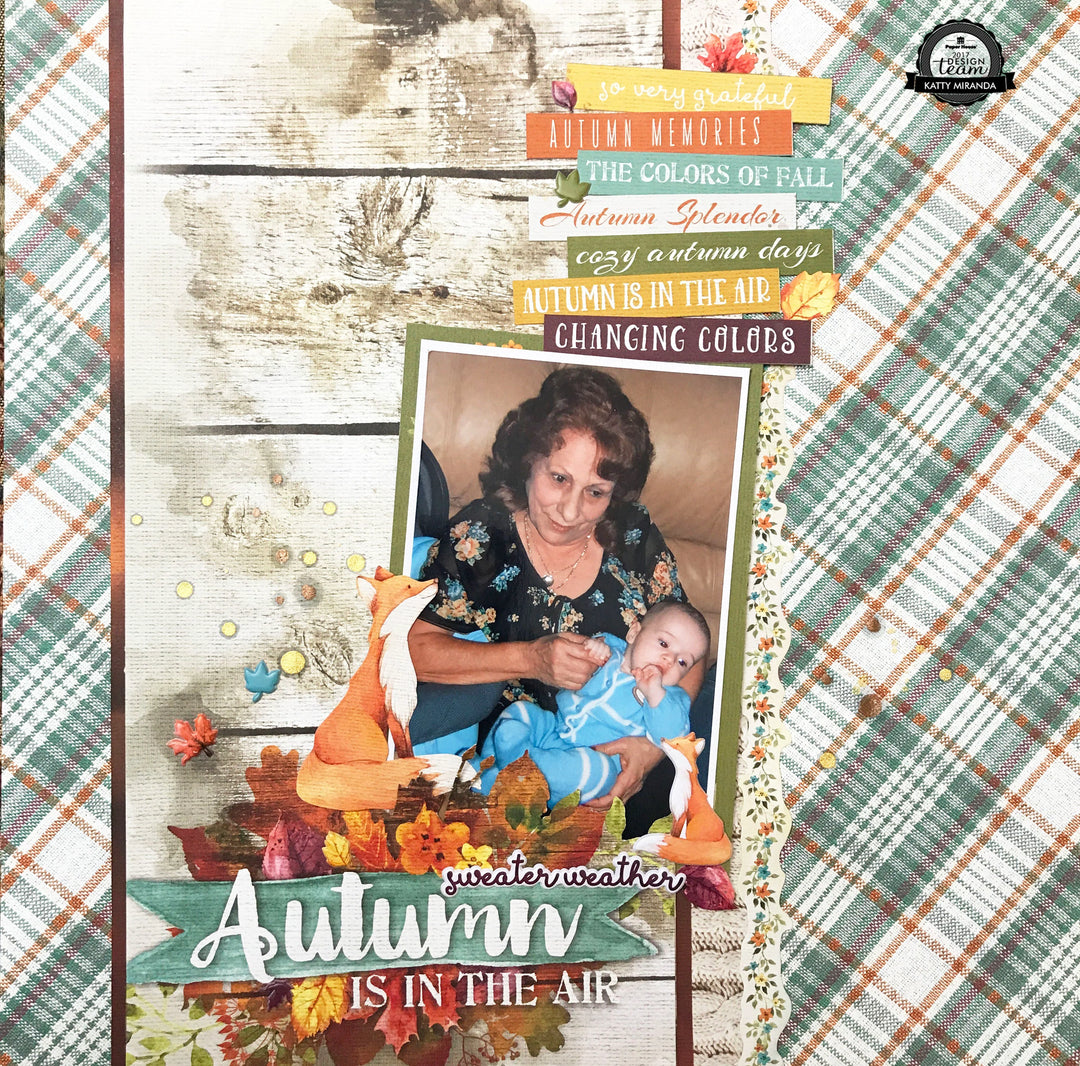 scrapbook layout featuring autumn themed background with plaid and a photo of a woman holding a baby.