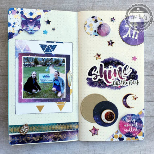 small-scale scrapbook layout created in travelers notebook with purple and gold celestial-themed stickers