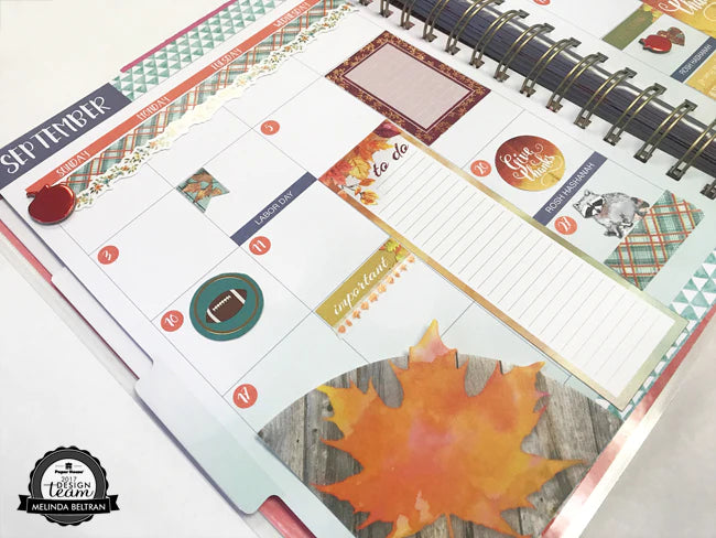close up of planner spread featuring fall stickers.