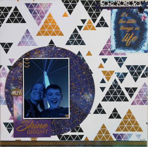 scrapbook page featuring a mom and son at night on a bridge in Omaha. The page is on a white, purple, and gold background