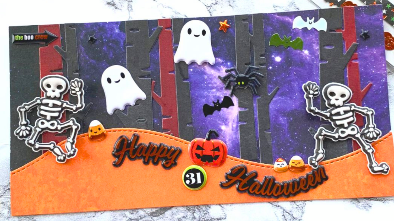 DIY Halloween card features cute ghost and skeleton stickers on a starry nighttime background.