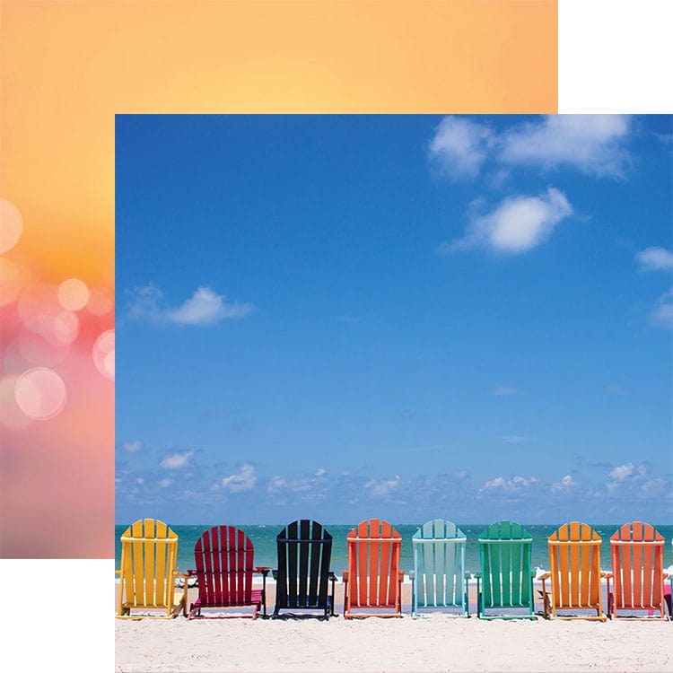 scrapbook paper featuring a photographic image of a row of colorful chairs along the beach shown overlapping a bokeh pattern of orange and pink.
