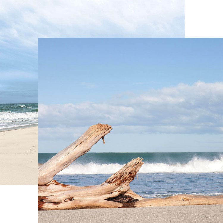 scrapbook paper featuring a photographic image of driftwood on the beach shown overlapping a photo image of the beach.
