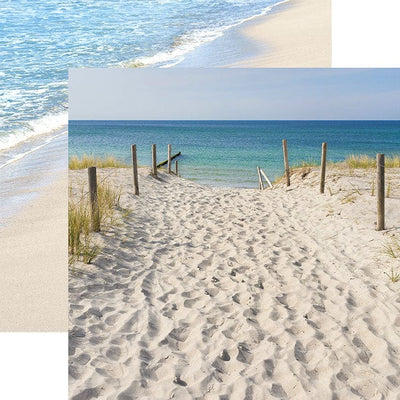 scrapbook paper featuring a photographic beach scene of footprints on a path leading to a beach overlapping a photo of the beach.