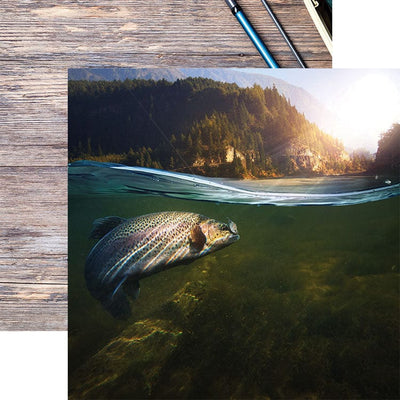 scrapbook paper featuring a close up photographic image of a trout under water with sunshine above shown overlapping fish poles on a wooden surface.