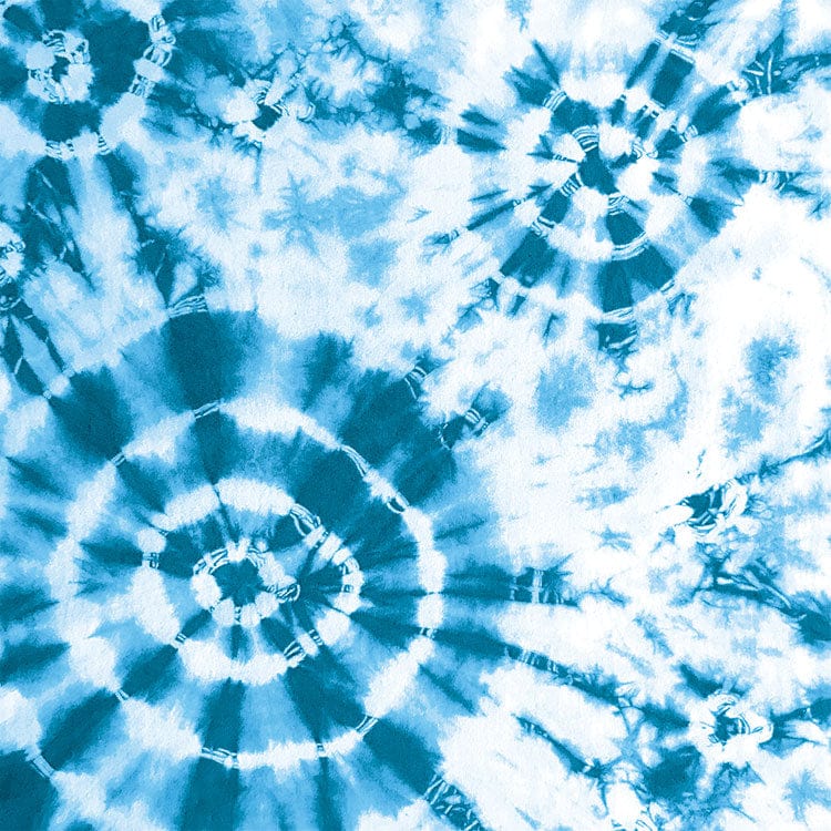 scrapbook paper featuring large circular blue tie-dye pattern on a white background.