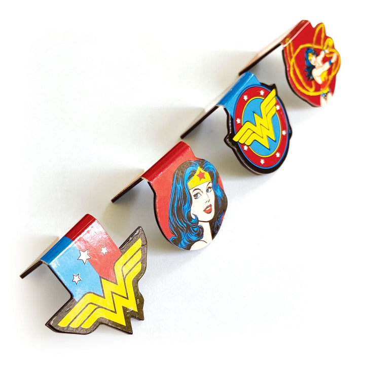 BMMG-0034E - Wonder Woman Magnetic Bookmarks - Four magnetic bookmarks featuring Wonder Woman imagery with red, blue, and yellow colors arranged diagonally on white background