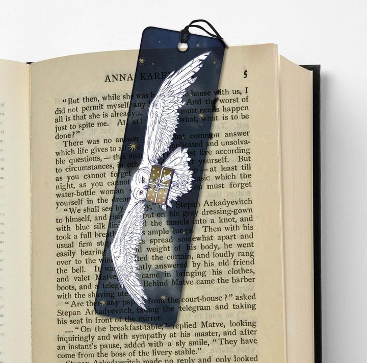 BMR-0002E - Harry Potter Hedwig Resin Bookmark - OFFICIALLY LICENSED - Navy blue bookmark with white owl illustration and small gift box design, displayed in open book