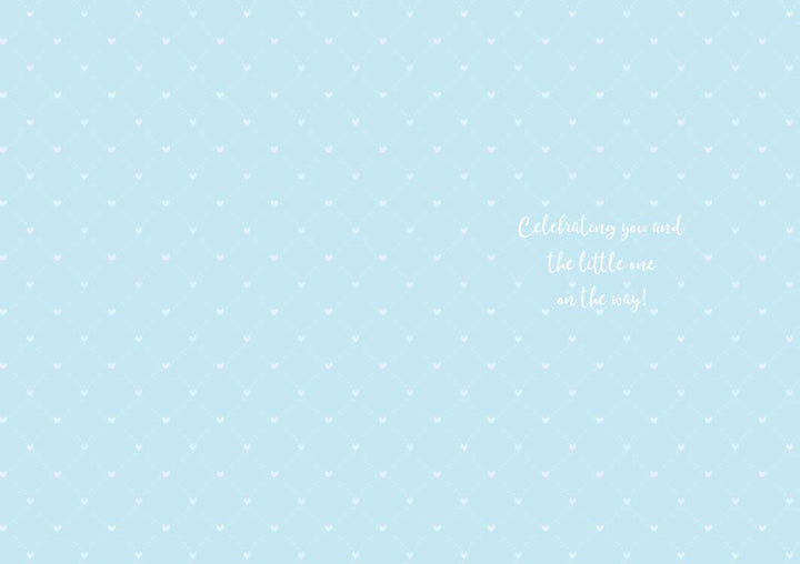 baby note card inside spread featuring a blue background with a tiny white heart pattern.