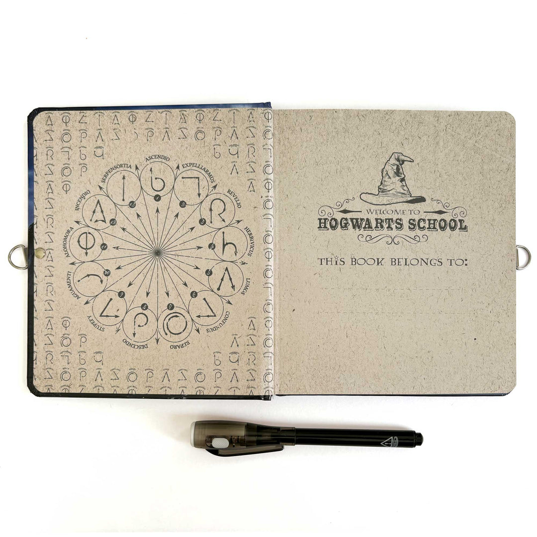DRY-1000E - Locking Diary - Harry Potter Invisible Ink - Open notebook with magical symbols and "Welcome to Hogwarts School" text, accompanied by an invisible ink pen