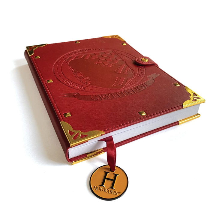 JL-0066E - Harry Potter Gryffindor Vegan Leather Journal - Red vegan leather journal with gold corner details, embossed crest, and Hogwarts charm bookmark