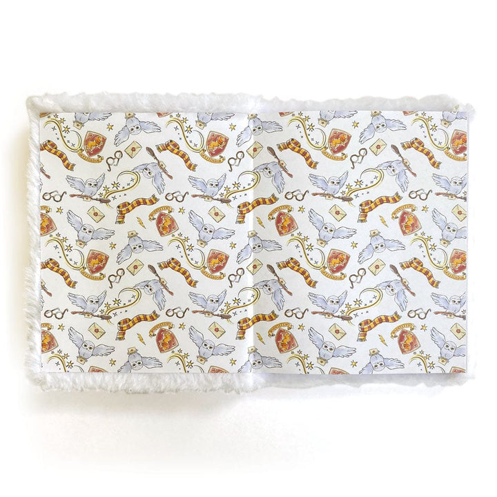 JLP-0002E - Harry Potter Journal Notebook - Plush Hedwig - White plush-bordered notebook with Harry Potter-themed pattern featuring owls, scarves, wands, and magical symbols in gold and burgundy tones
