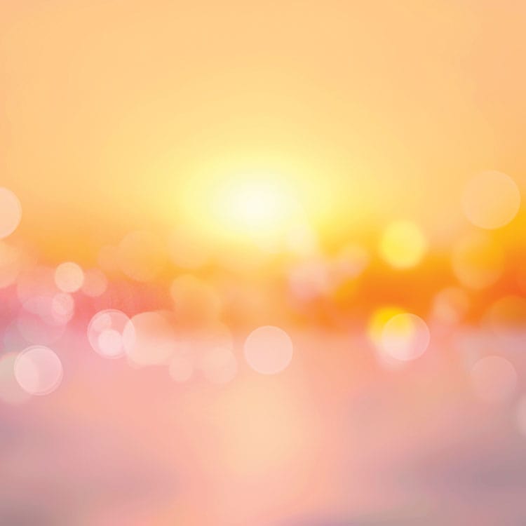 scrapbook paper featuring an orange, pink and yellow bokeh pattern