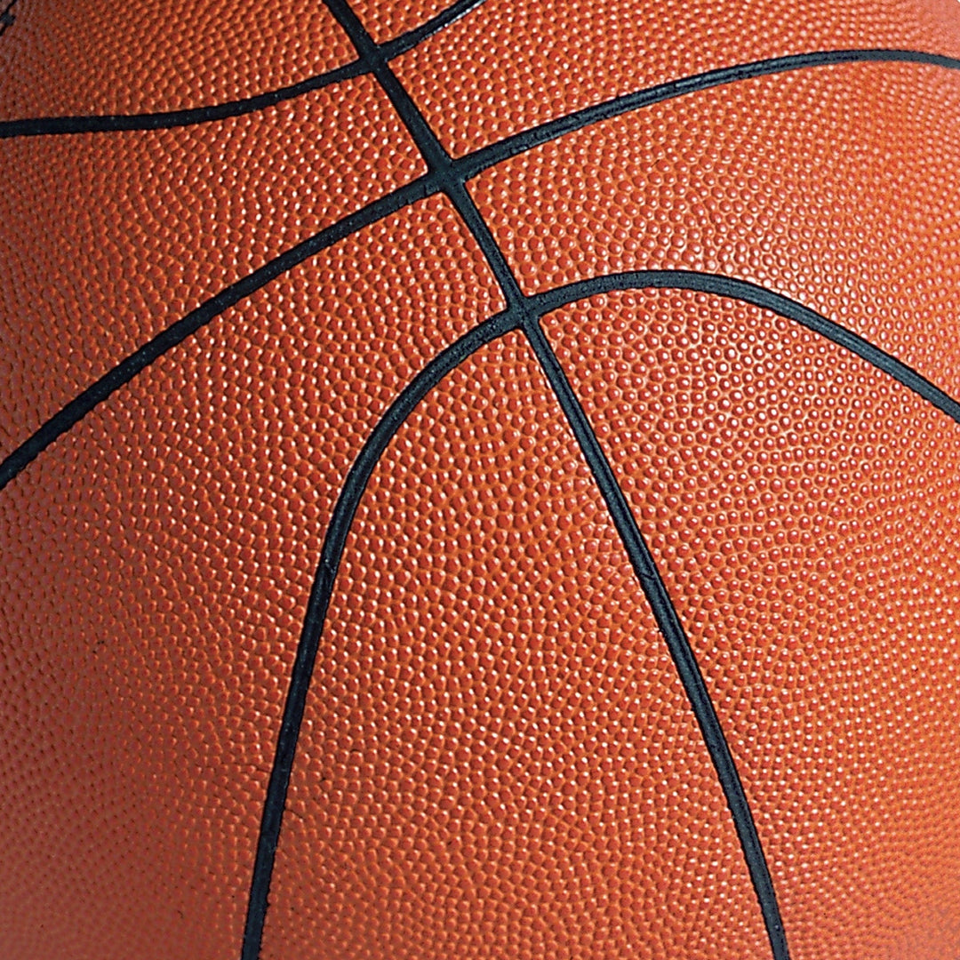 P-2403E - Basketball Tags 12 x 12 Scrapbook Paper - Close-up of orange basketball texture with black curved lines and dimpled surface pattern