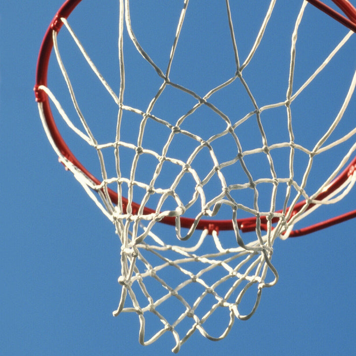 P-2405E - Basketball Hoop 12 x 12 Scrapbook Paper - Close-up of white netting and red metal rim of basketball hoop against clear blue sky