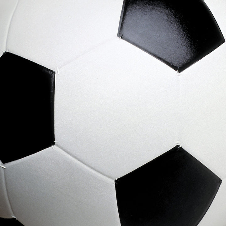 P-2415E - Soccer Tags 12 x 12 Scrapbook Paper - Close-up of scrapbook paper showing black pentagons and white hexagons in a soccer ball pattern