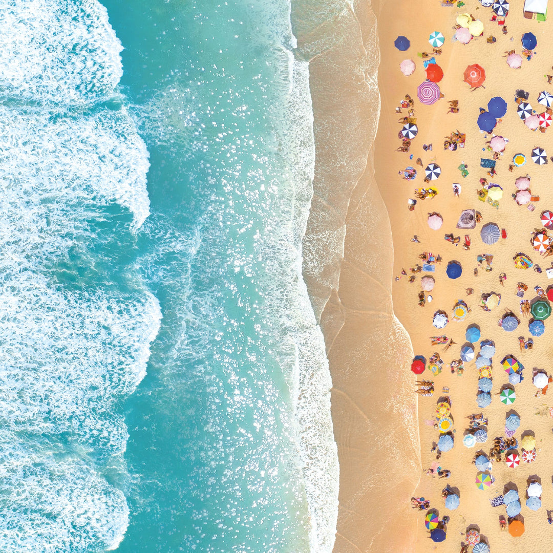 P-2421E - Beach Day 12 x 12 Scrapbook Paper - Aerial beach scene with turquoise waves, white foam, sandy shore, and colorful umbrellas and beachgoers scattered across the sand