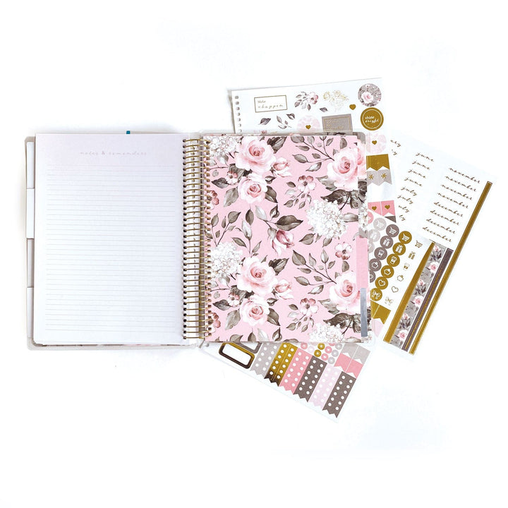 PL-2015E - Weekly Planner - Undated Soul Shine - Spiral-bound planner with pink floral cover, lined pages, and coordinating gold and pink decorative stickers and washi tape