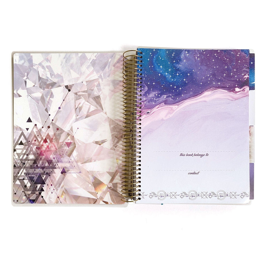 PL-2018E - Weekly Planner - Undated Stargazer - Spiral-bound planner open showing geometric patterned left page and starry purple right page with ownership lines and decorative border
