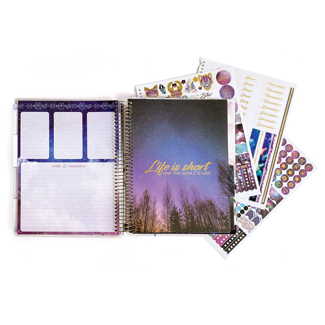 PL-2018E - Weekly Planner - Undated Stargazer - Purple galaxy-themed spiral planner with "Life is short" text, open pages showing notes section, and colorful sticker sheets fanned beside it
