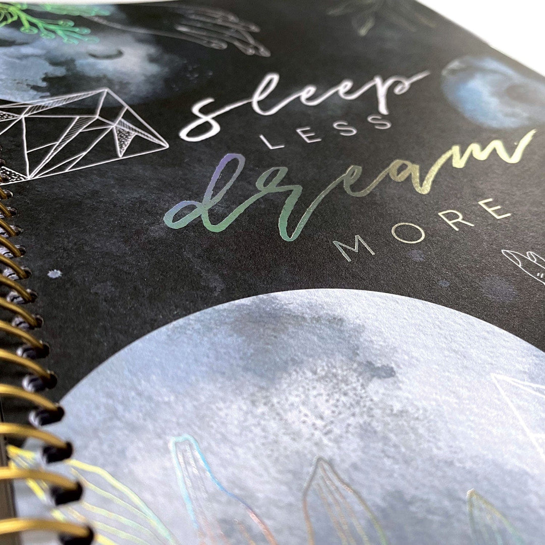 PL-2021E - Weekly Planner - Sun &amp; Moon Celestial - Spiral-bound black planner with celestial design featuring moon, geometric patterns, and iridescent foil text on cover
