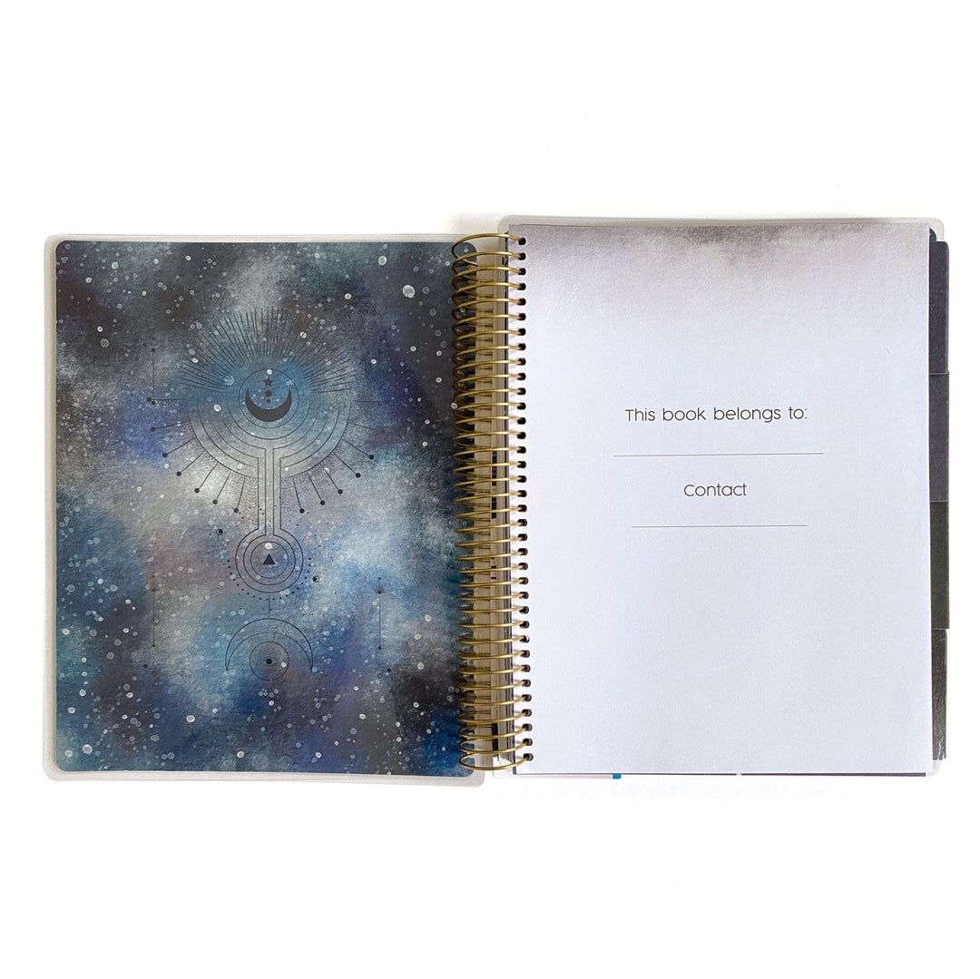 PL-2021E - Weekly Planner - Sun &amp; Moon Celestial - Spiral-bound planner open showing celestial-themed front cover with moon and geometric designs in blue tones, and ownership page on right