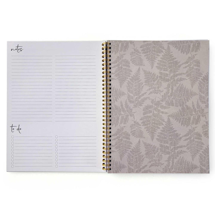 PL-2036E - Books &amp; Flowers 12 Month Undated Planner - Open spiral-bound planner showing notes and to-do list pages on left, fern-patterned cover on right with gold binding