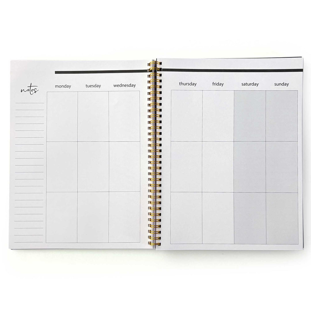 PL-2036E - Books &amp; Flowers 12 Month Undated Planner - Open spiral-bound weekly planner with gold binding, notes section, and seven-day grid layout in neutral tones