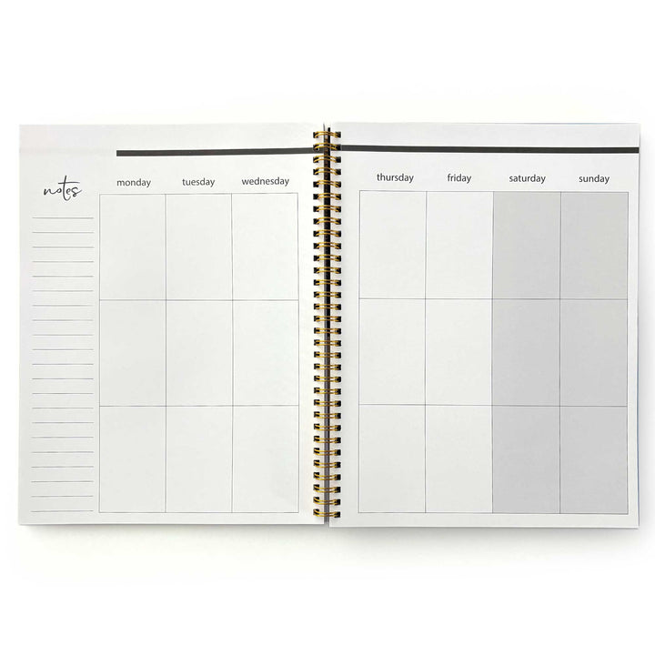 PL-2040E - Through the Keyhole 12 Month Undated Planner - Open spiral-bound planner showing weekly layout with Monday-Sunday columns, notes section, and gold binding