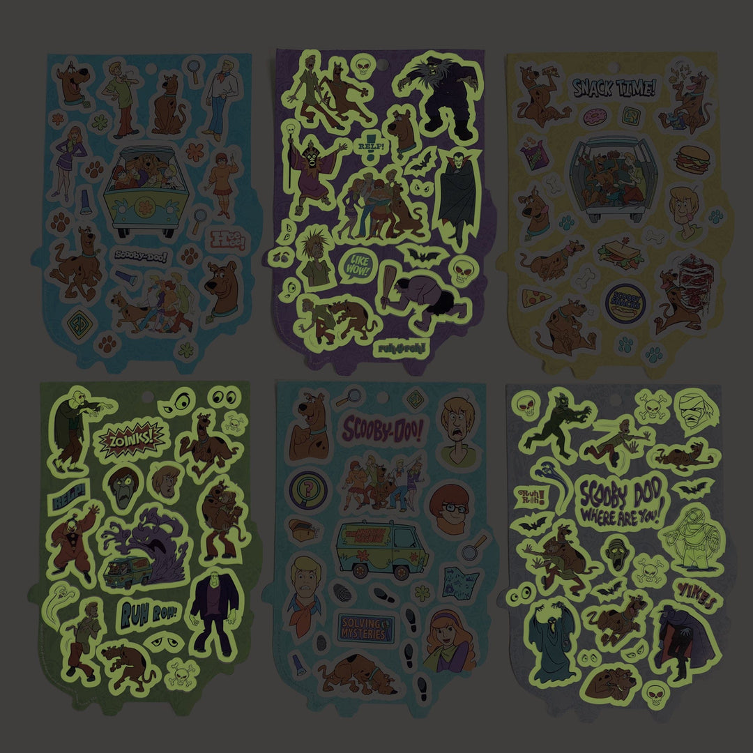 STBK-3000E - Scooby Doo Mystery Machine Sticker Book - Six colorful sticker sheets featuring Scooby-Doo characters, mystery themes, and glow-in-the-dark elements on blue, purple, yellow, and green backgrounds
