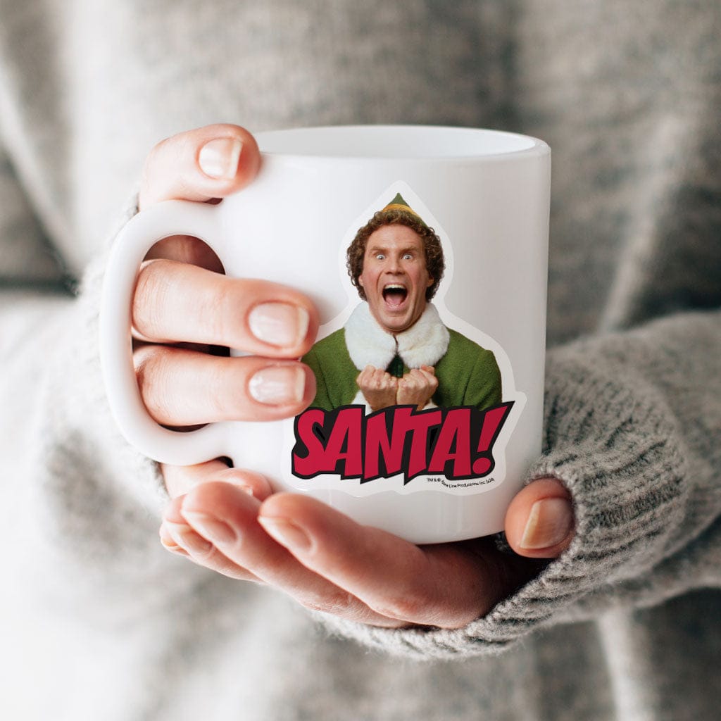STUV-0117E - Elf - Santa Vinyl Sticker - White mug held in hands wearing gray sweater, displaying vinyl sticker of excited character in green elf costume with "SANTA!" text