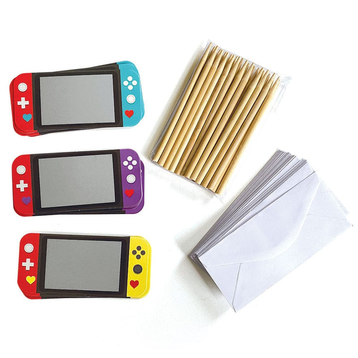 VPL-7031E - Valentine Cards Set - Video Game Scratch Offs - Three red handheld gaming controllers with colored joy-cons (blue, purple, yellow) alongside gold pens and white scratch-off cards