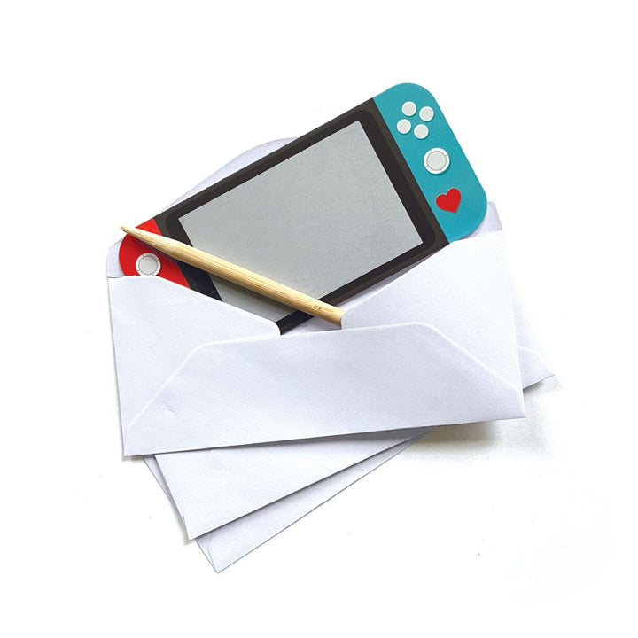 VPL-7031E - Valentine Cards Set - Video Game Scratch Offs - Nintendo Switch with red and blue controllers and heart symbol nestled in white envelopes with gold pencil