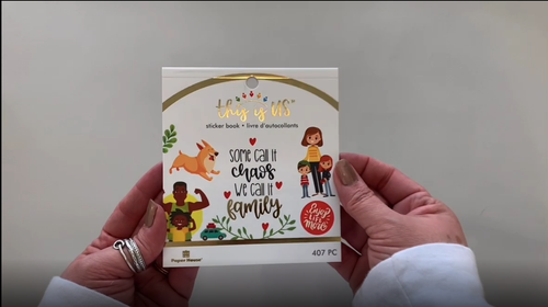 Female hands pick up and flip through the pages of this family planner stickers booklet to show each page of stickers in detail. There are twelve pages in this sticker book by Paper House Productions.