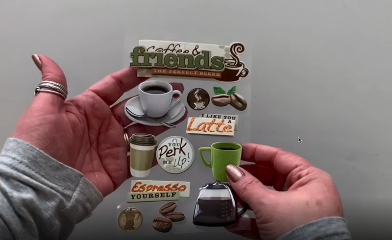 Female hands pick up and show front and back of photo real 3D decorative stickers featuring coffee mugs and coffee beans