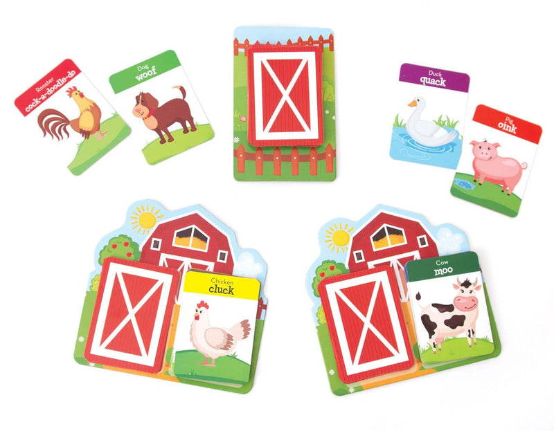 kids card game featuring farm animal cards with a red barn, shown on white background.