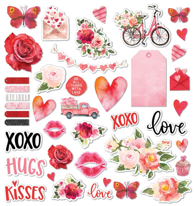 scrapbook die cuts are shown on a white background, featuring pink florals, butterflies and hearts.
