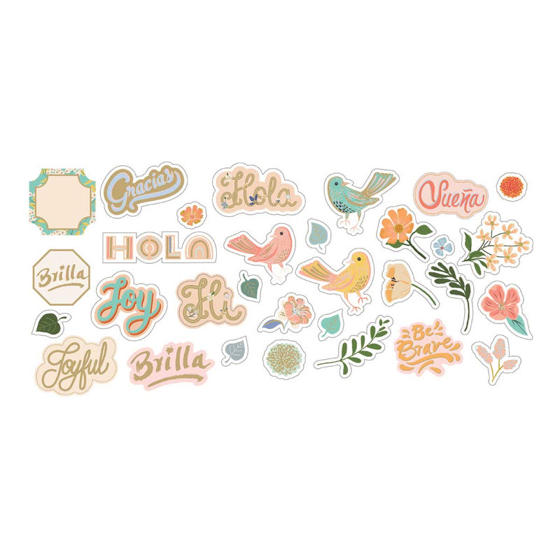 Scrapbook die cuts featuring an assortment of pastel colored, illustrated florals and spanish words of encouragement show on white background.