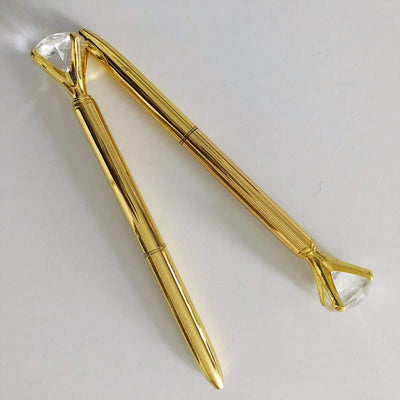 2 gold pens with diamond rhinestone at tip, shown on white background.